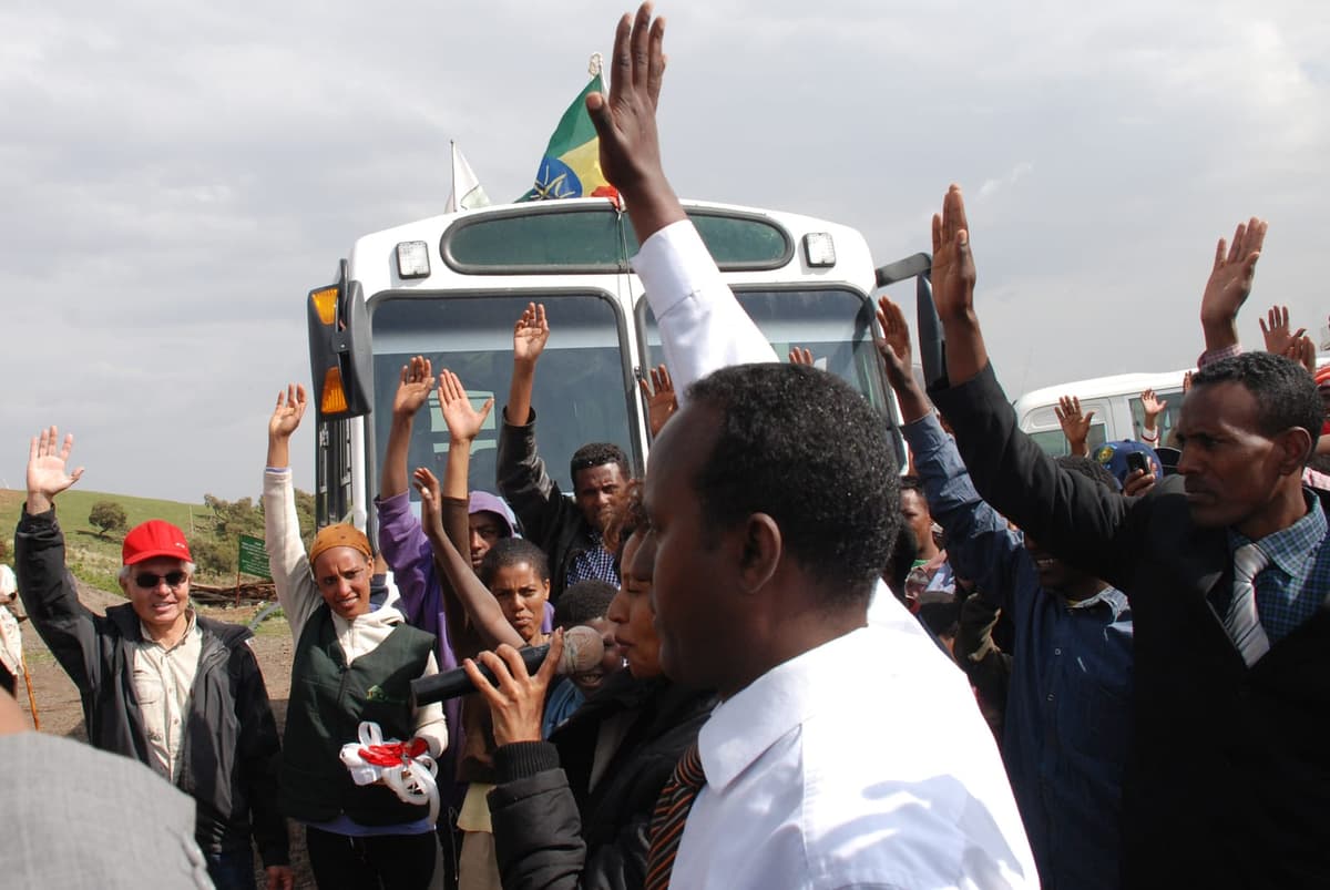 Crowd welcoming the new community bus