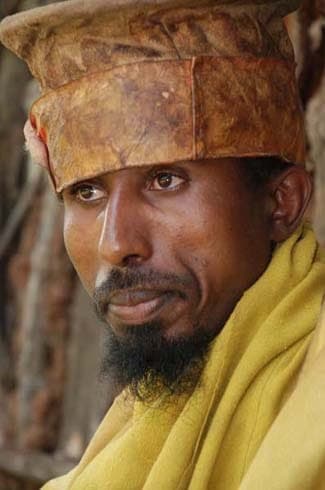Ethiopian Orthodox priest in a yellow robe