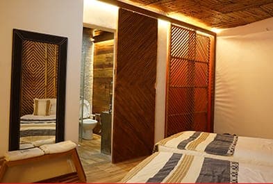 Main room with twin beds and an en-suite bathroom