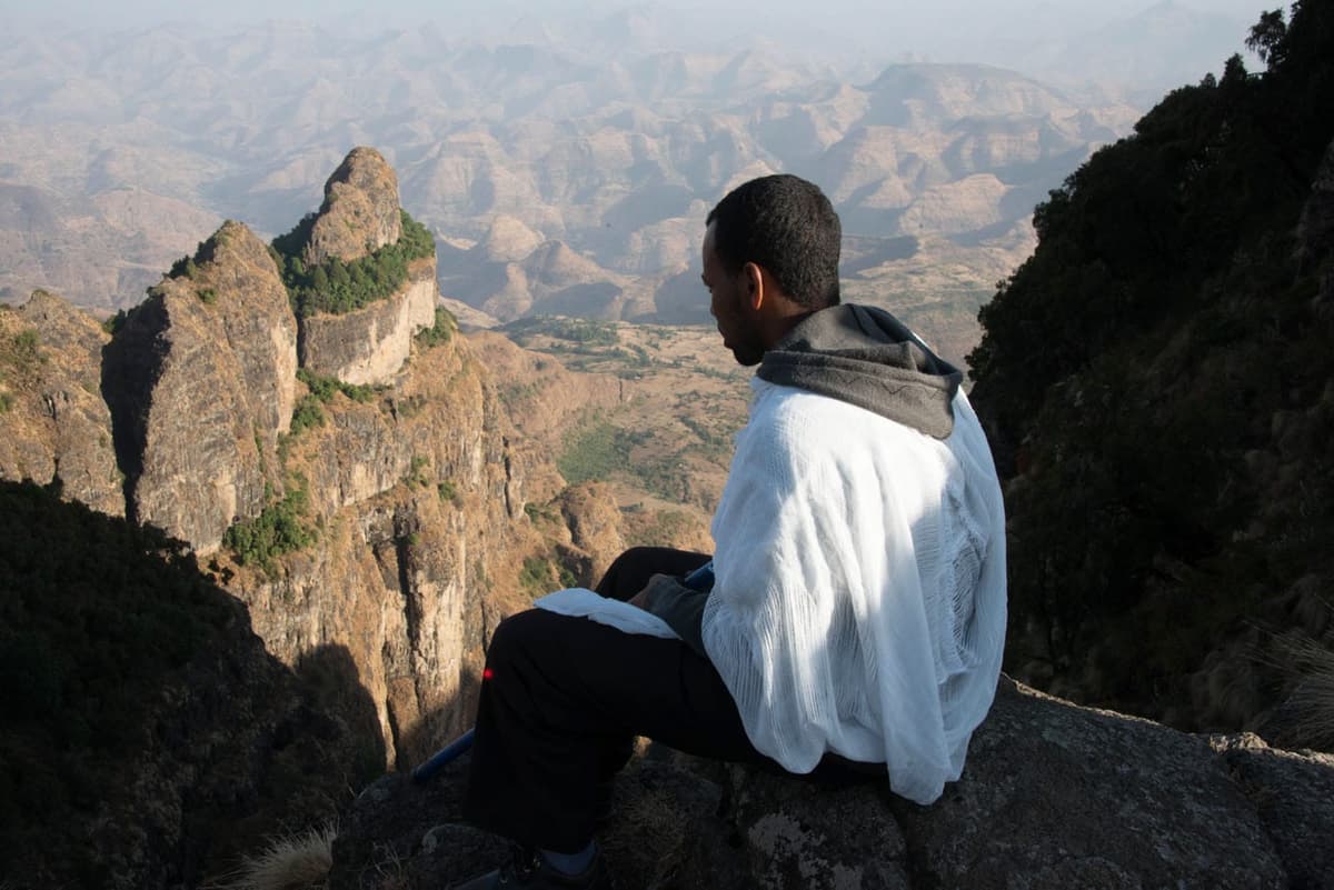 Man looking out over the cliffs near Saddique Amba