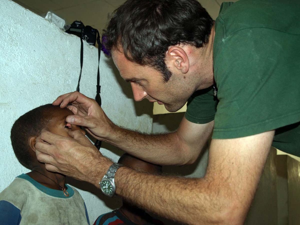 Doctor checking a child’s eyes for trachoma