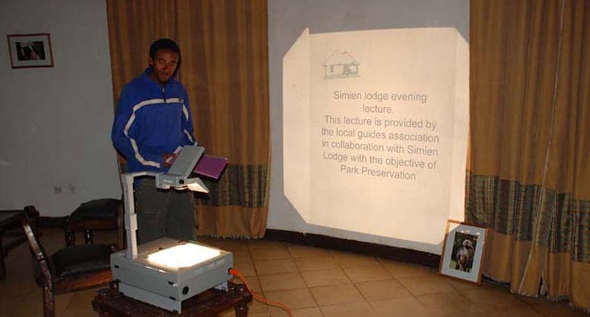 Evening talk with a projector at the lodge