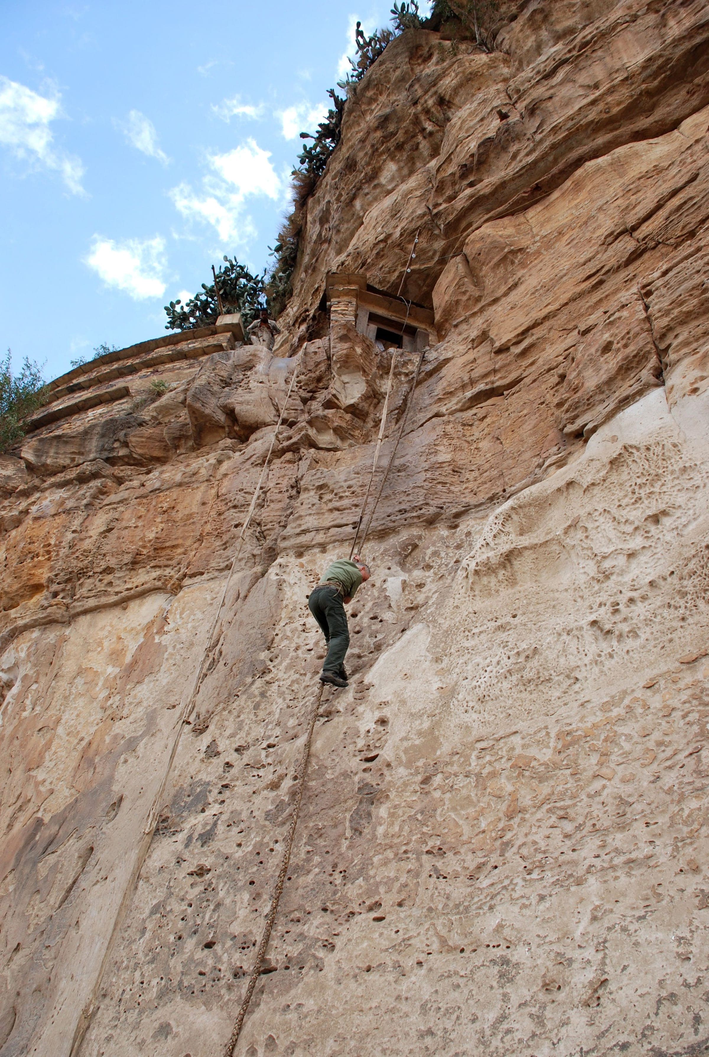 Climber on a rock face in the Simien Mountains