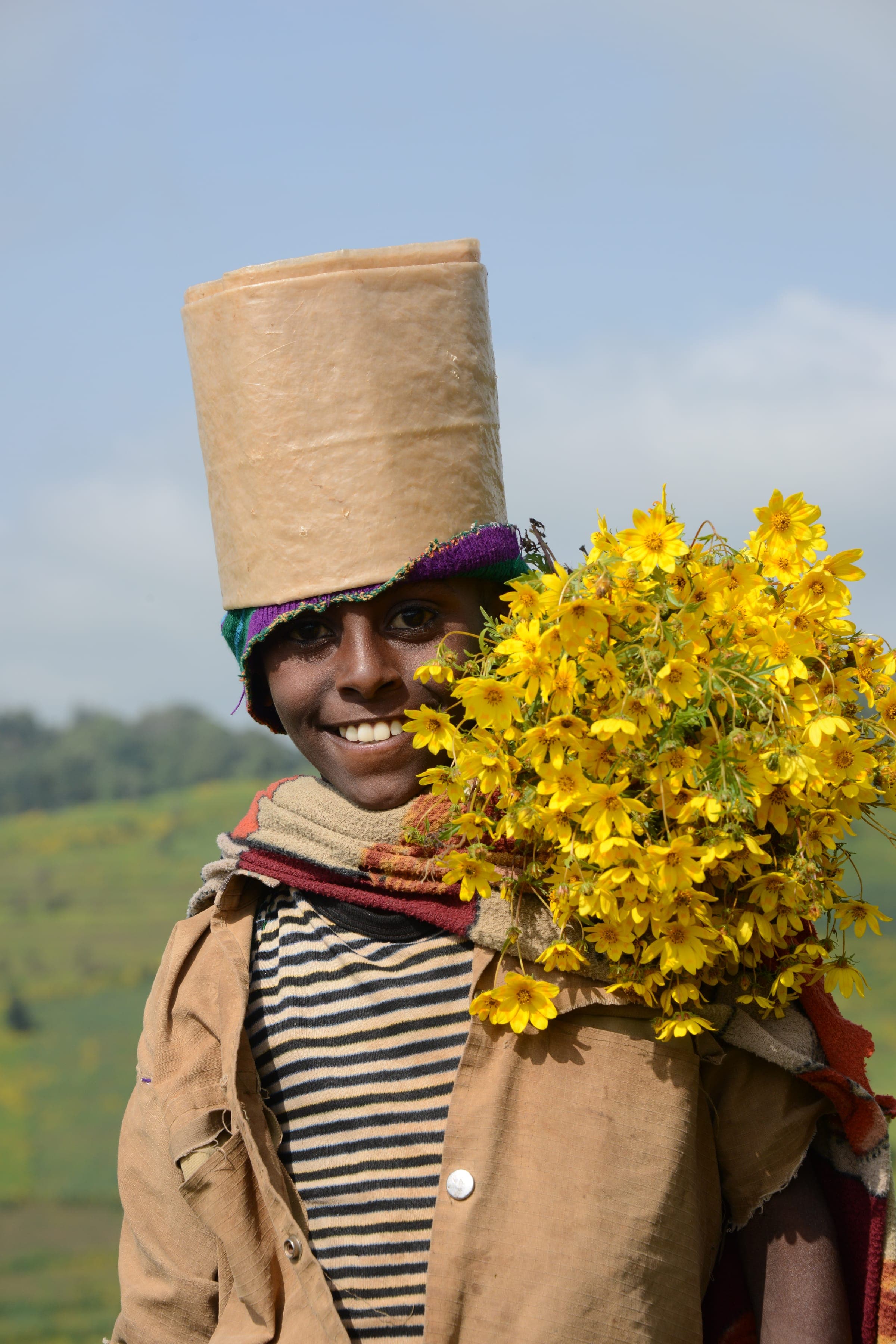 A man carrying yellow flowers