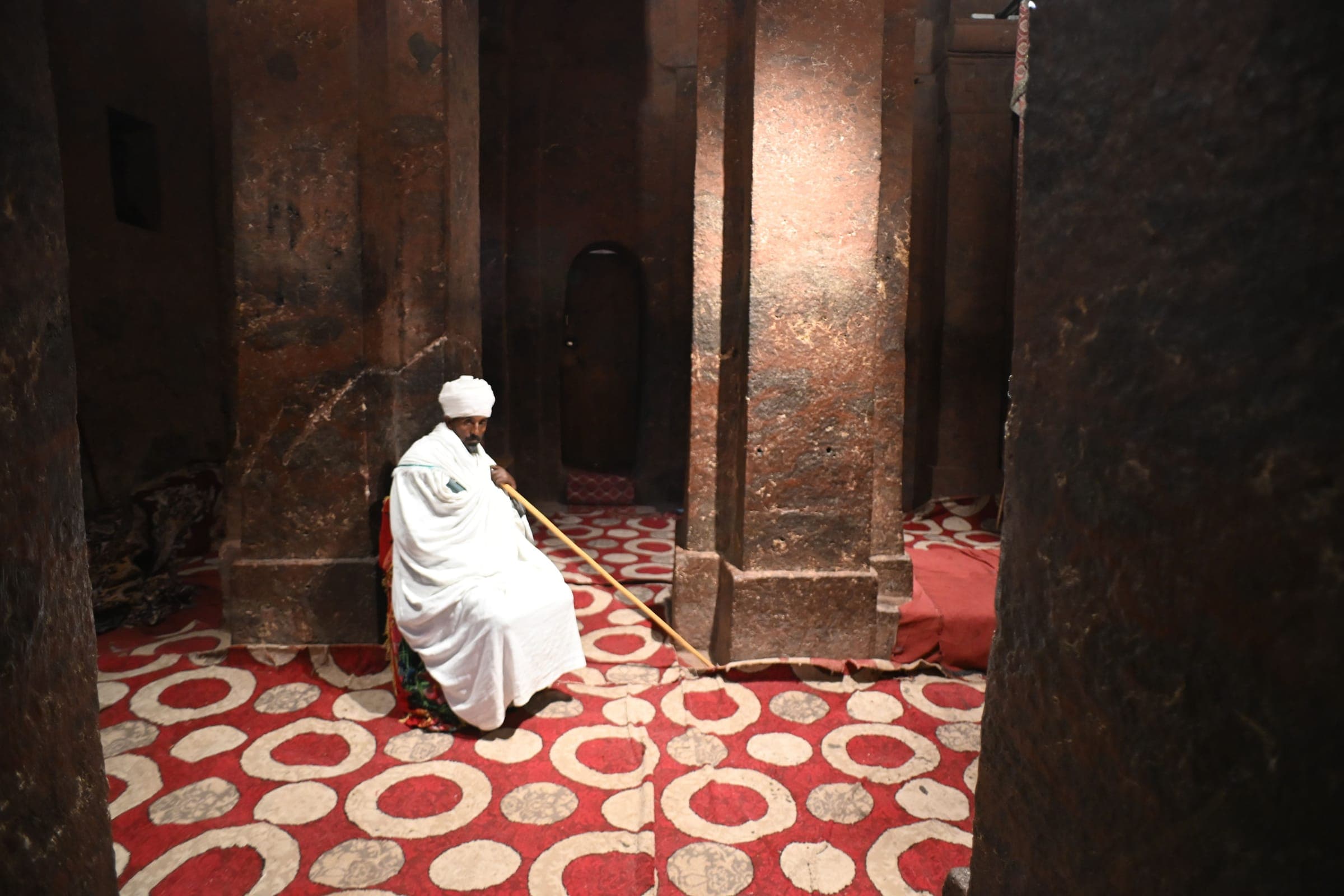 A priest inside a rock-hewn church in Lalibela