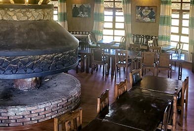 Restaurant with a round central fireplace
