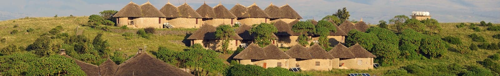 Simien Lodge’s thatched tukuls among green hills